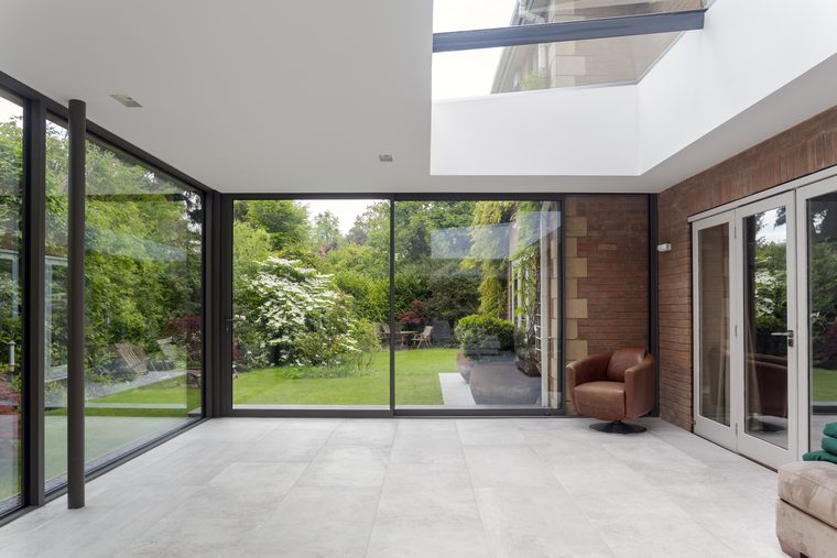 Inside a garden room with aluminium bi-fold doors and a roof lantern
